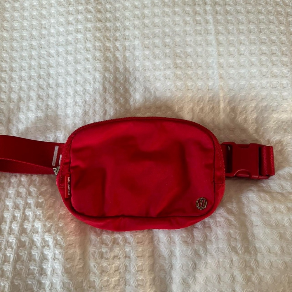 Red employee lululemon belt bag